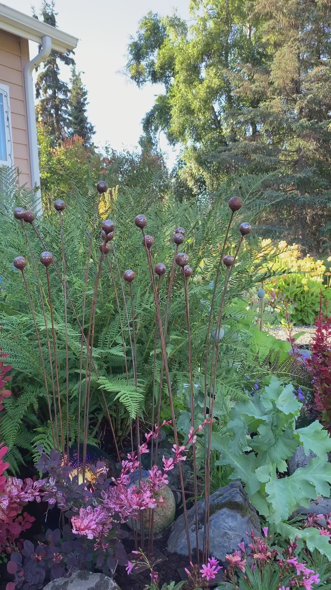 Video of Steel Kinetic garden in flower bed